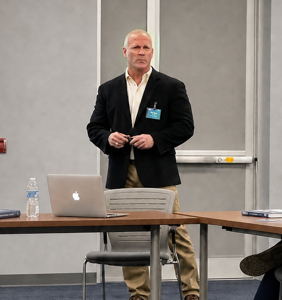 Jason Sullivan at the front of a training room
